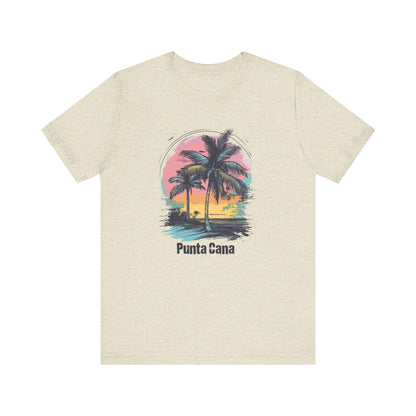 A heather prism natural T-shirt with a vibrant color design featuring palm trees and a sunset with the text 'Punta Cana' on it.