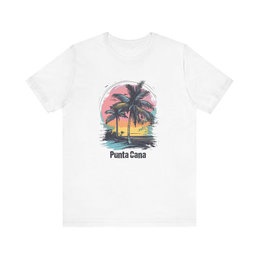 A white crew-neck T-shirt with a vibrant color design featuring palm trees and a sunset, and the text 'Punta Cana'.
